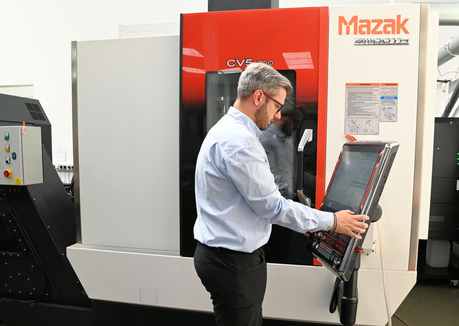 Yamazaki Mazak.
First Mazak CV5-700 5-axis machining centre purchased in UK at Tigfusion Ltd.

Jack Walsom (Managing Director, Tigfusion Ltd) with the Mazak CV5-700 5-axis machining centre.


Photo by Andy Butler
andybutlerphoto@outlook.com