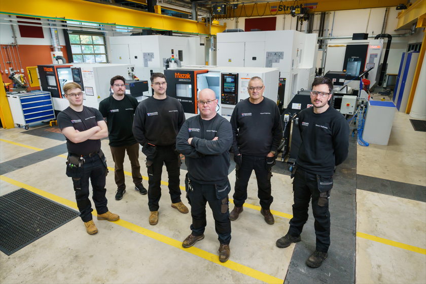 Stuart Baker (centre) with the University's team of technicians