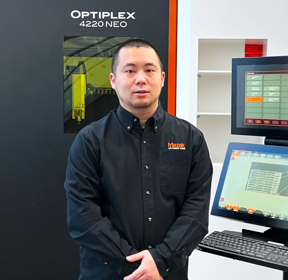 Person Standing in Front of Machine